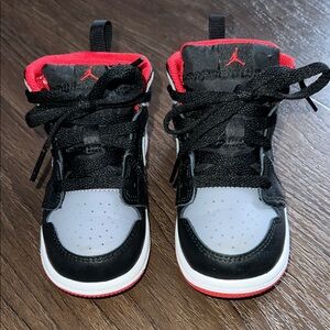 Kids Jordan Black and Red Sneakers